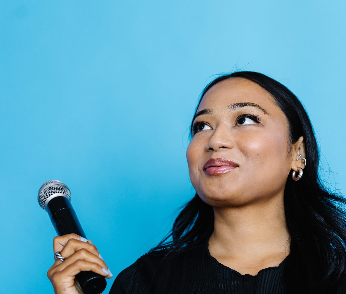 Public speaking training participant holding a microphone