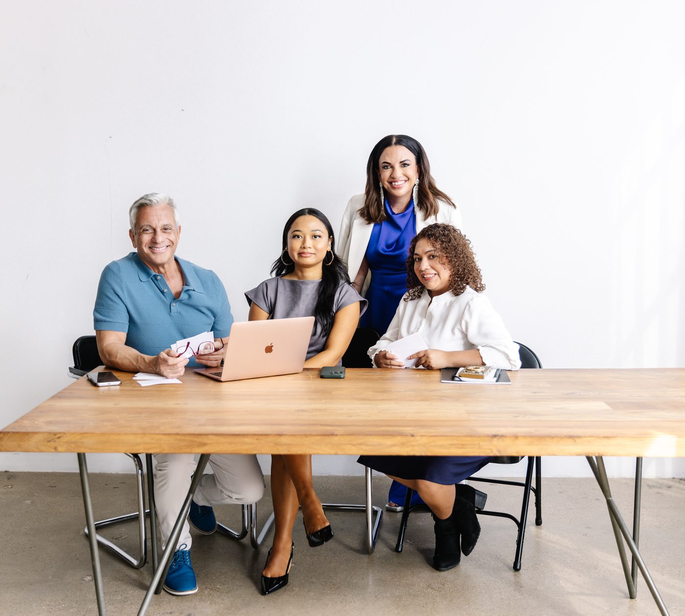 Executive presence coaching session with a small leadership team at a table