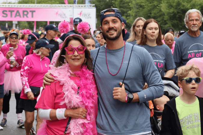 Participants dressed in pink at the start line of a Susan G. Komen Chicago race